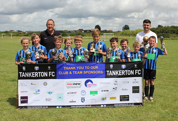 TFC U10s Lions with their squad and individual trophies