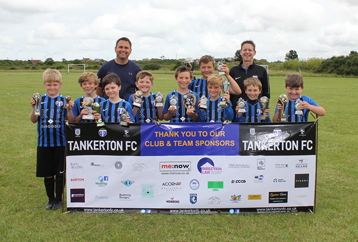 TFC U9s with their squad and individual trophies